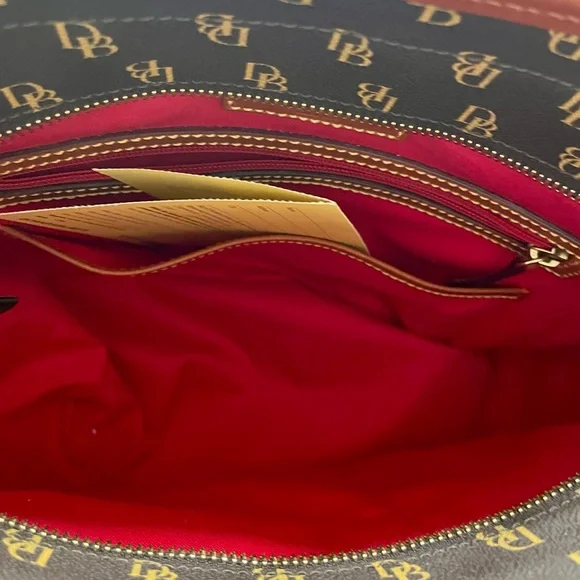 Beautiful Dooney and Bourke large purse with registration card. - Picture 10 of 16